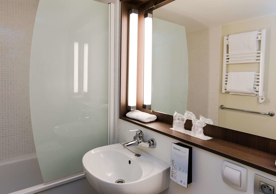 Eco-friendly toiletries, hair dryer, towels