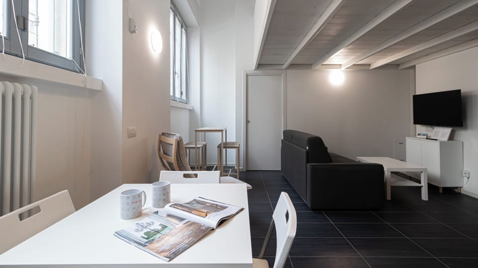 Apartment (2 Bedrooms) | Living area | 32-inch Smart TV with cable channels