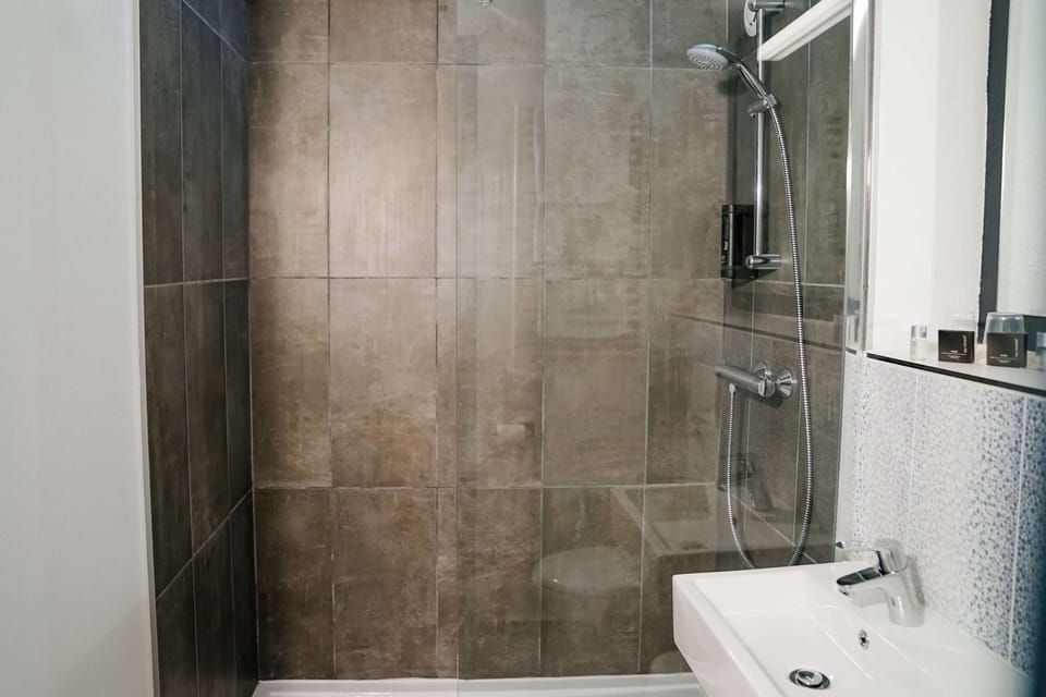 Shower, eco-friendly toiletries, hair dryer, towels
