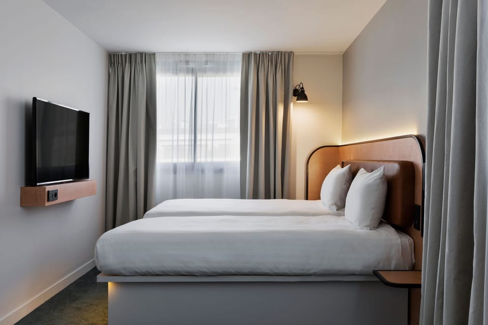 Room, 2 Twin Beds (Moxy Sleeper) | Blackout drapes, travel crib, rollaway beds (free), WiFi (free)