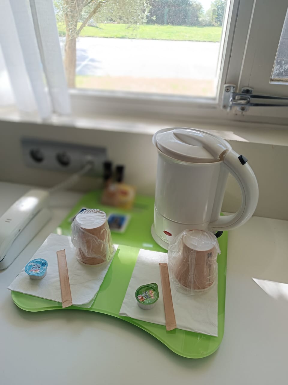 Premium bedding, desk, laptop workspace, blackout drapes