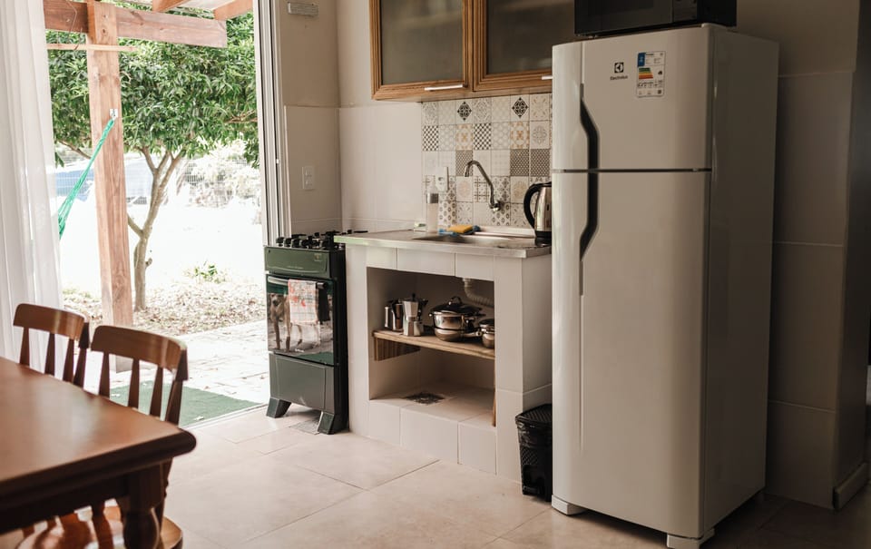 Family Apartment | Private kitchen | Mini-fridge, microwave, oven, cookware/dishes/utensils