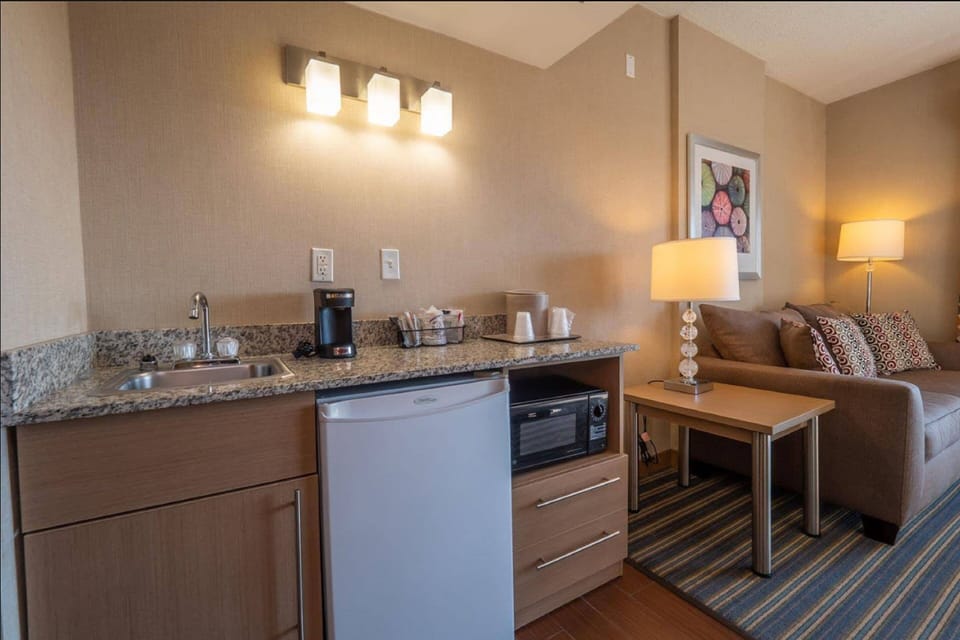 Suite South, 2 Queen Beds & Sofa Bed, Limited View, Balcony | Private kitchenette | Fridge, microwave, coffee/tea maker