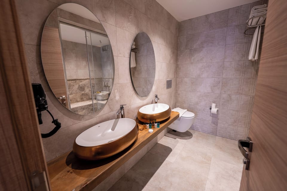 Exclusive Room | Bathroom | Shower, hair dryer, slippers, towels