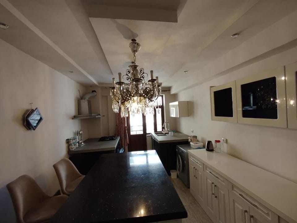 Electric kettle, griddle, spices, dining tables