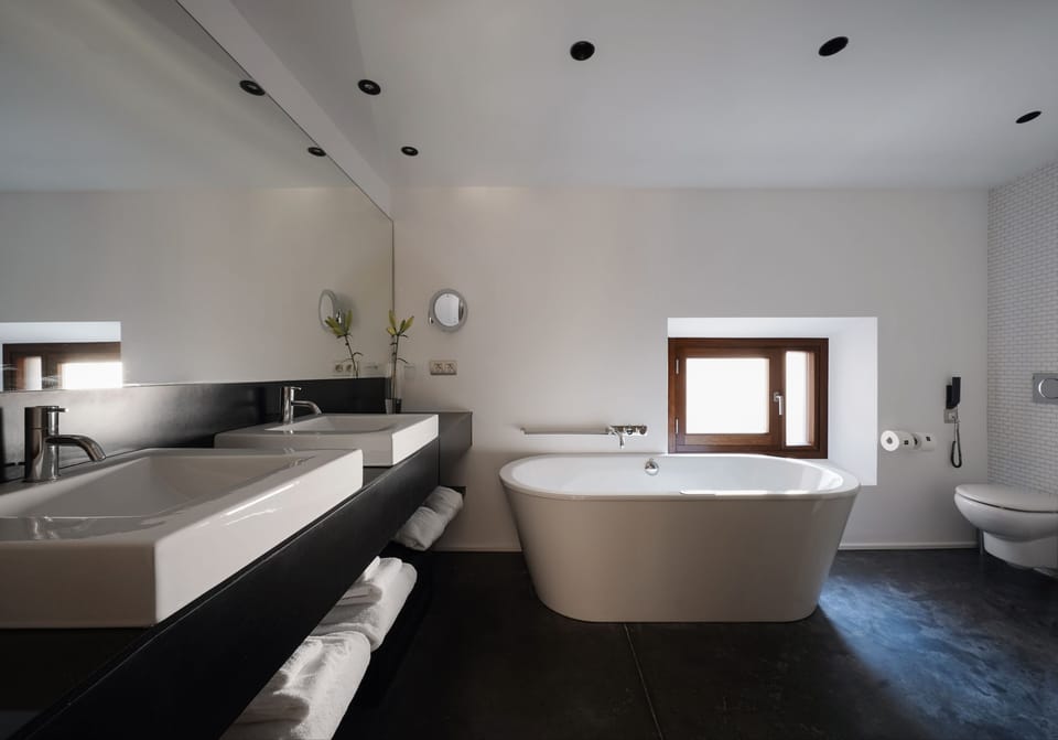 Superior Duplex, Jetted Tub | Bathroom | Separate tub and shower, rainfall showerhead, designer toiletries