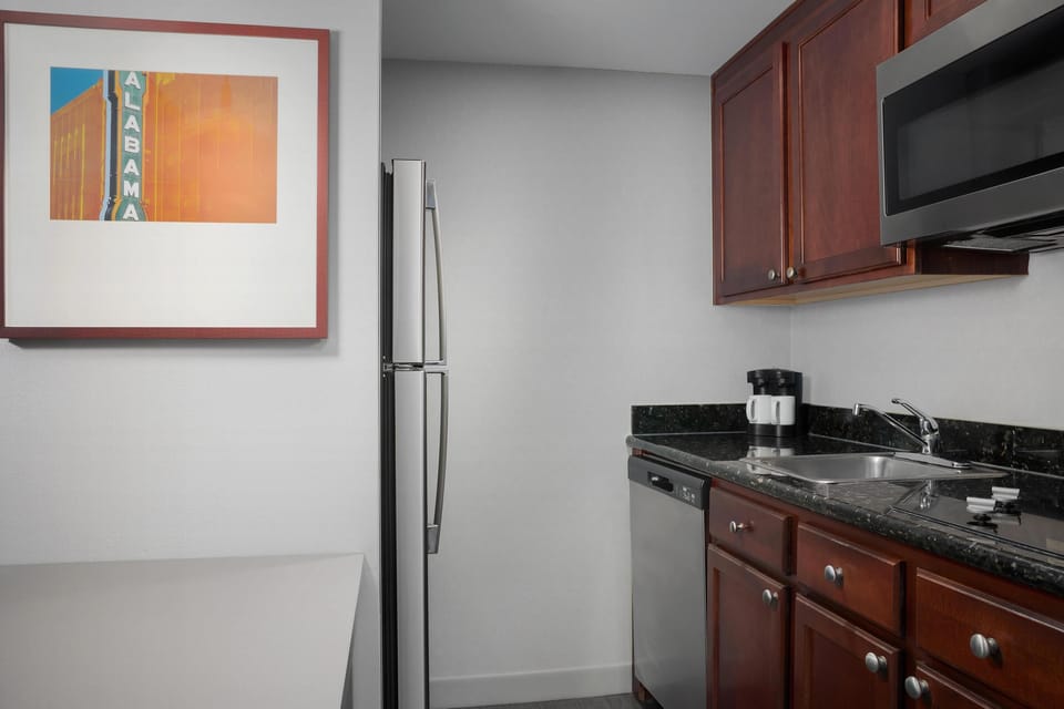 Full-size fridge, microwave, stovetop, dishwasher