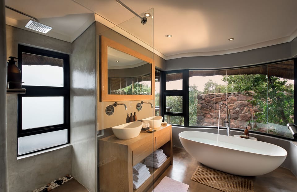 Executive Suite, 2 Bedrooms | Bathroom | Separate tub and shower, deep soaking tub, free toiletries, bathrobes