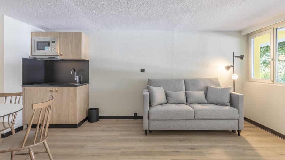 Family Room, 1 King Bed with Sofa bed | Private kitchenette | Coffee/tea maker, eco-friendly cleaning products