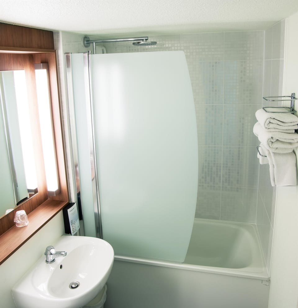 Combined shower/tub, eco-friendly toiletries, hair dryer, towels