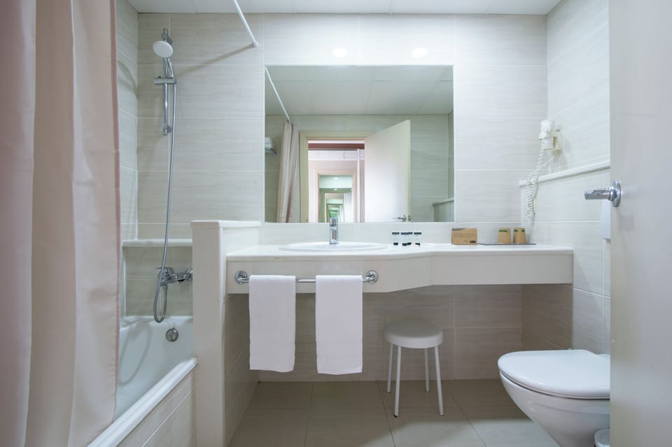 Hair dryer, towels, soap, shampoo