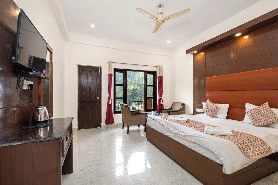 Deluxe Room With Garden View | Premium bedding, desk, laptop workspace, free WiFi