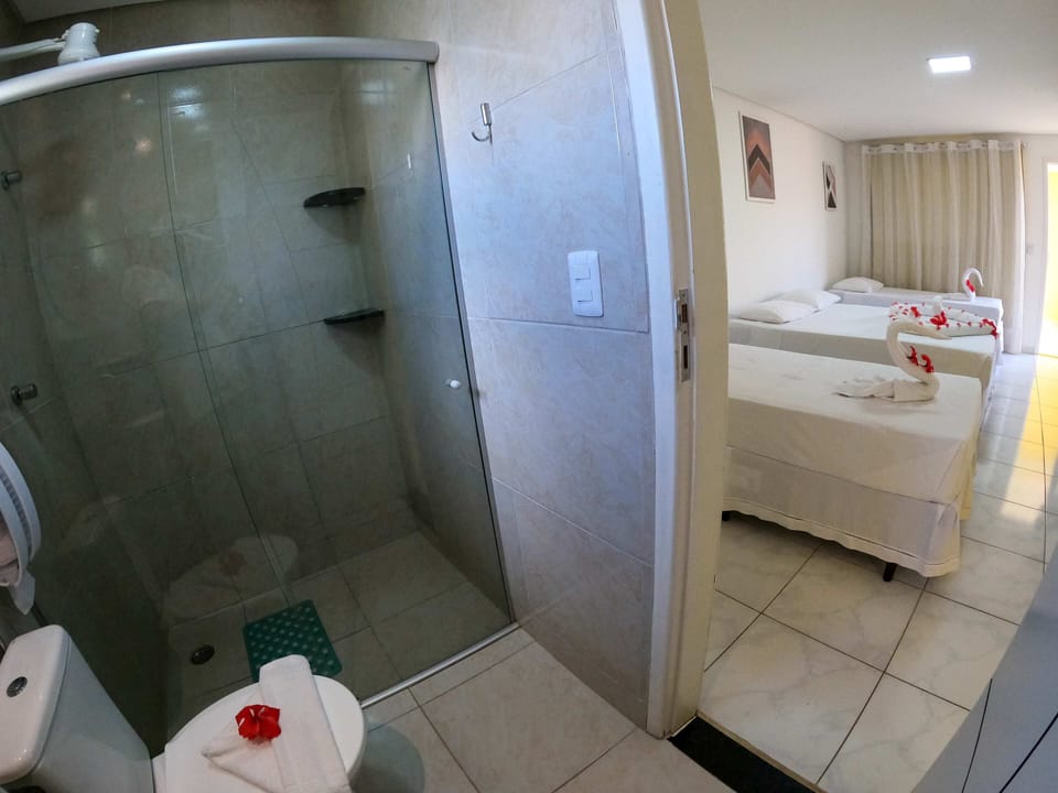 Family Quadruple Room | Bathroom | Shower, free toiletries, hair dryer, towels