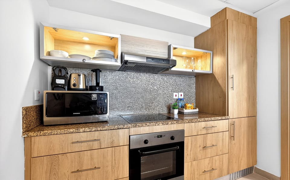 Standard Apartment, Beach View | Private kitchen | Full-size fridge, microwave, oven, stovetop