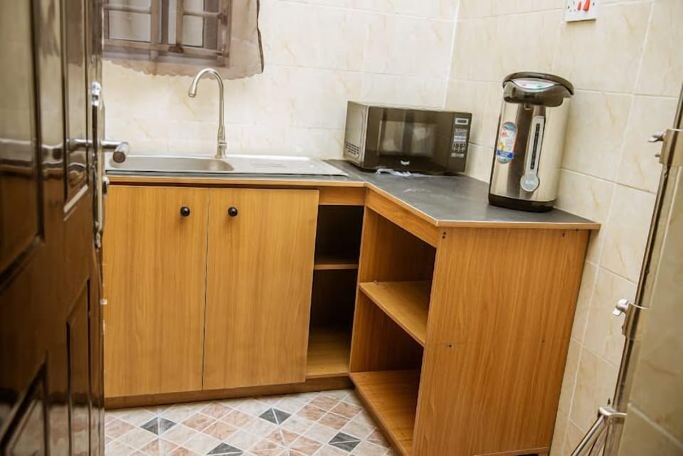Economy Apartment, Balcony, City View | Private kitchen | Fridge, microwave, oven, stovetop