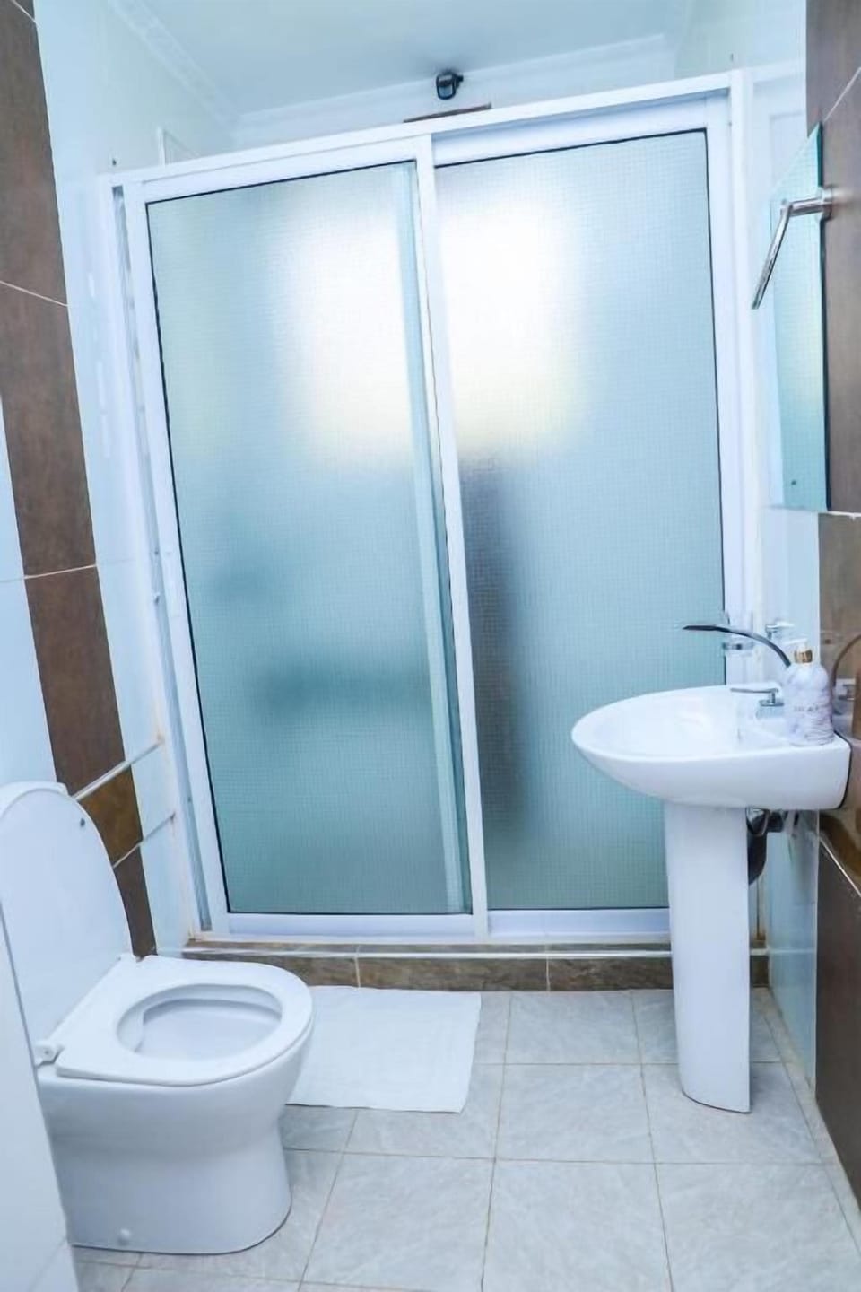 Shower, slippers, towels, soap