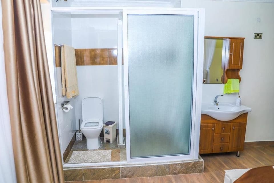 Deluxe Double Room, Garden View | Bathroom | Shower, slippers, towels, soap