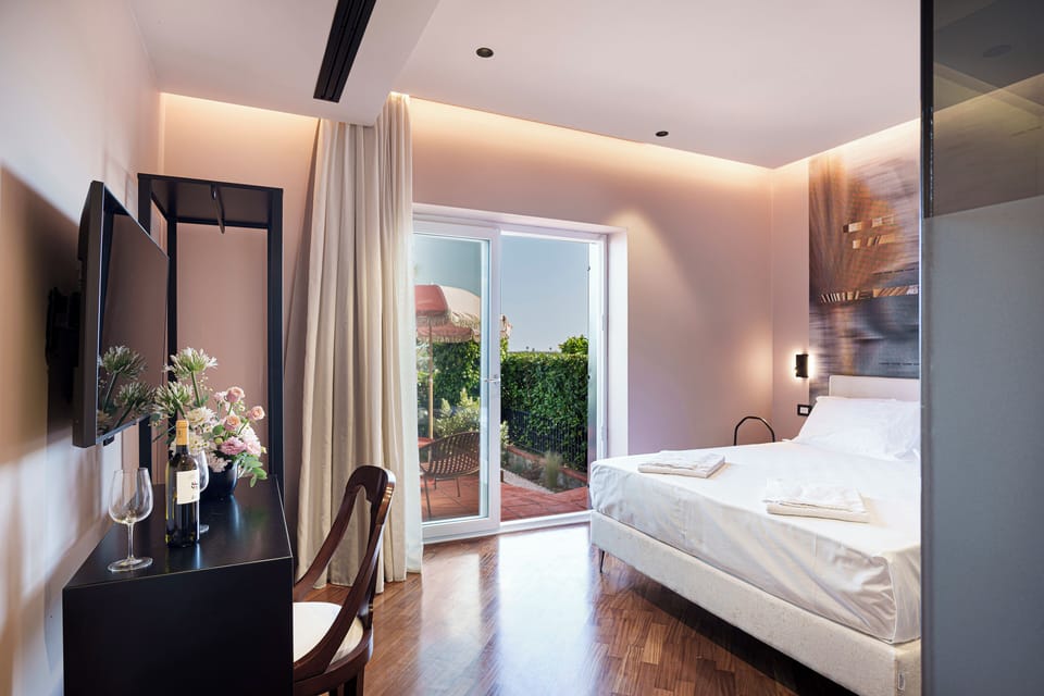 Deluxe Double Room, Courtyard View, Garden Area | In-room safe, desk, free WiFi