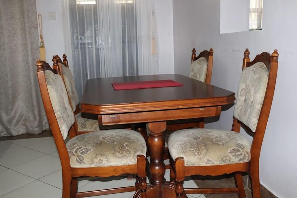 Apartment, Garden View | Living area | 24-inch Smart TV with digital channels