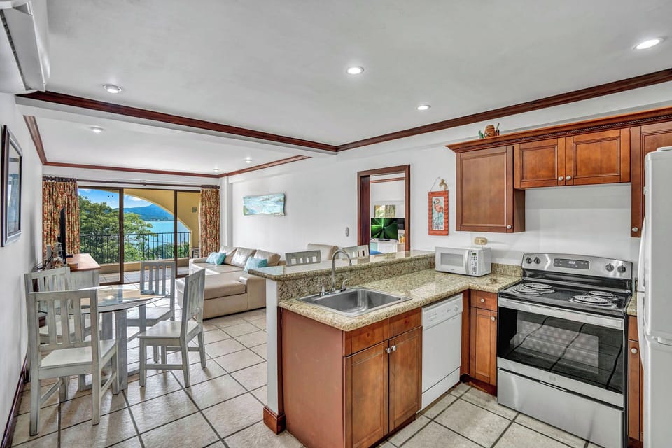 Condo, Balcony, Ocean View | Private kitchen | Electric kettle, toaster