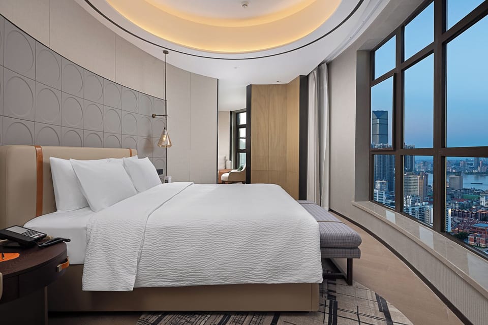Signature Studio Suite | Premium bedding, down comforters, desk, laptop workspace