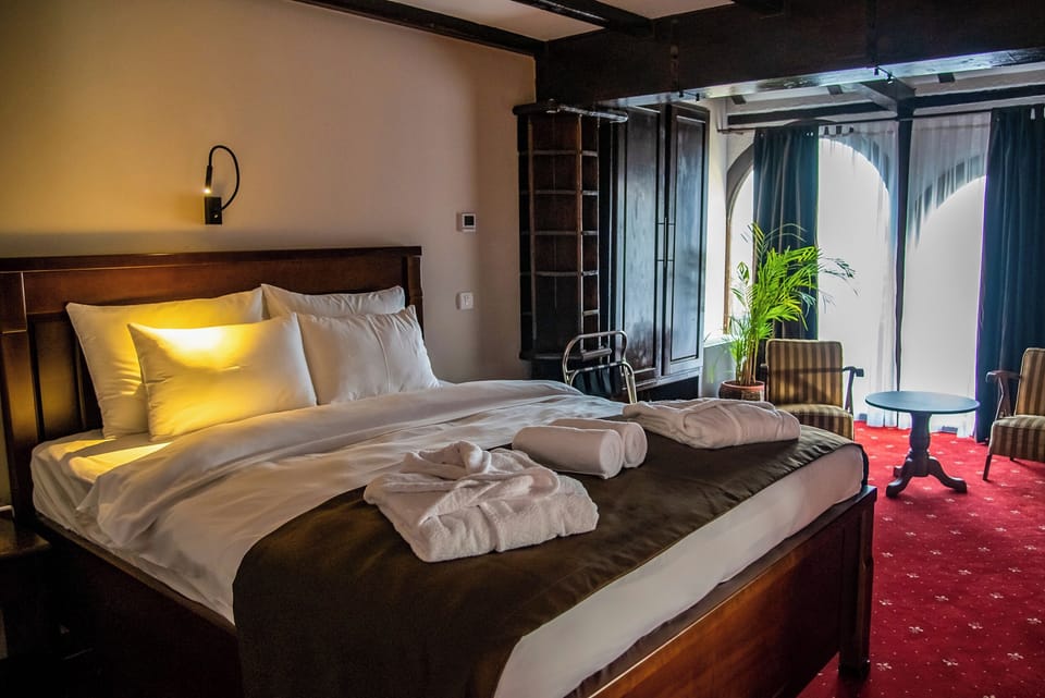 Deluxe Double Room, River View | Premium bedding, minibar, in-room safe, individually decorated