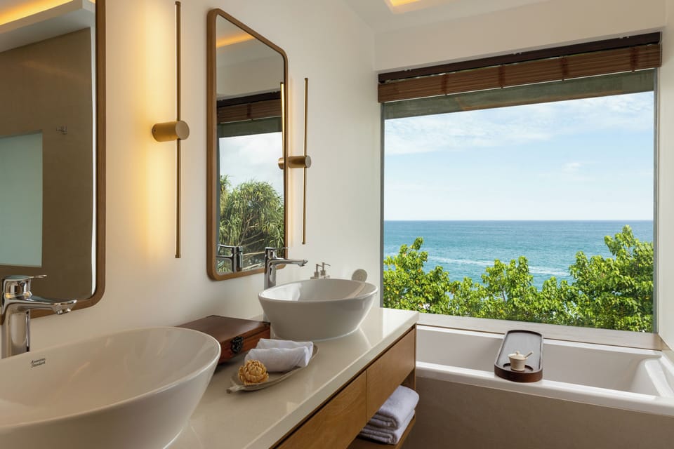 Horizon Suite | Bathroom | Hair dryer, slippers, bidet, towels