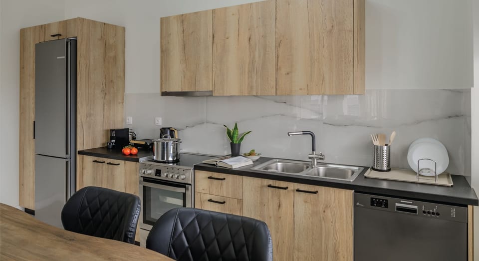 Superior Apartment, City View | Private kitchen | Full-size fridge, toaster, cookware/dishes/utensils, dining tables