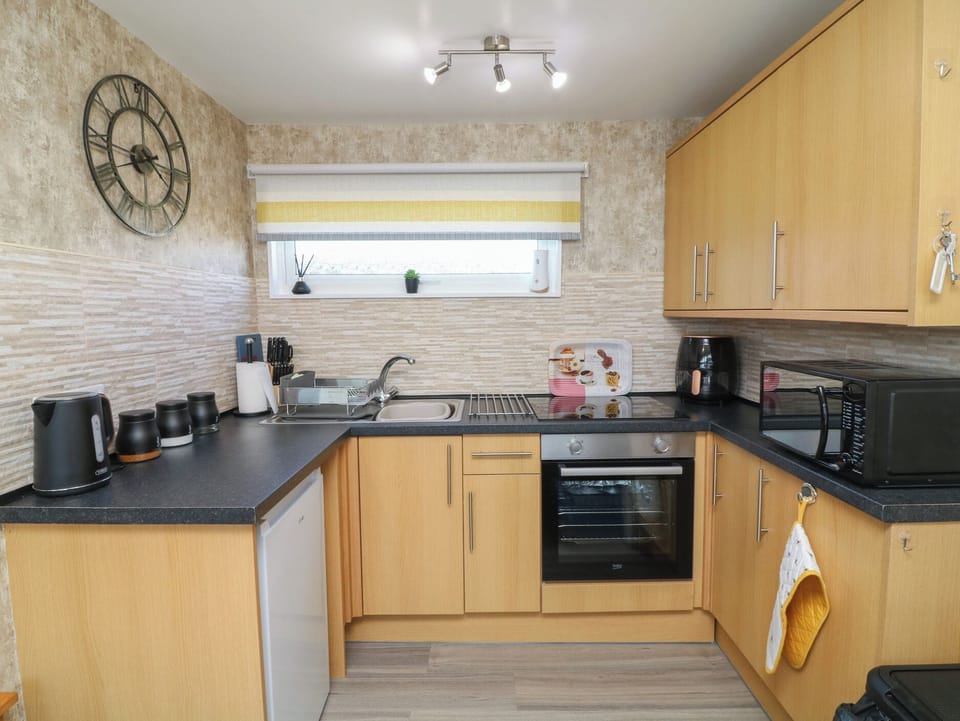 Fridge, microwave, cookware/dishes/utensils