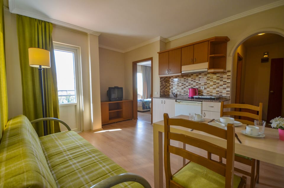 Family Apartment, 1 Bedroom, Kitchenette, Partial Sea View | Private kitchen | Fridge, stovetop, electric kettle, cookware/dishes/utensils
