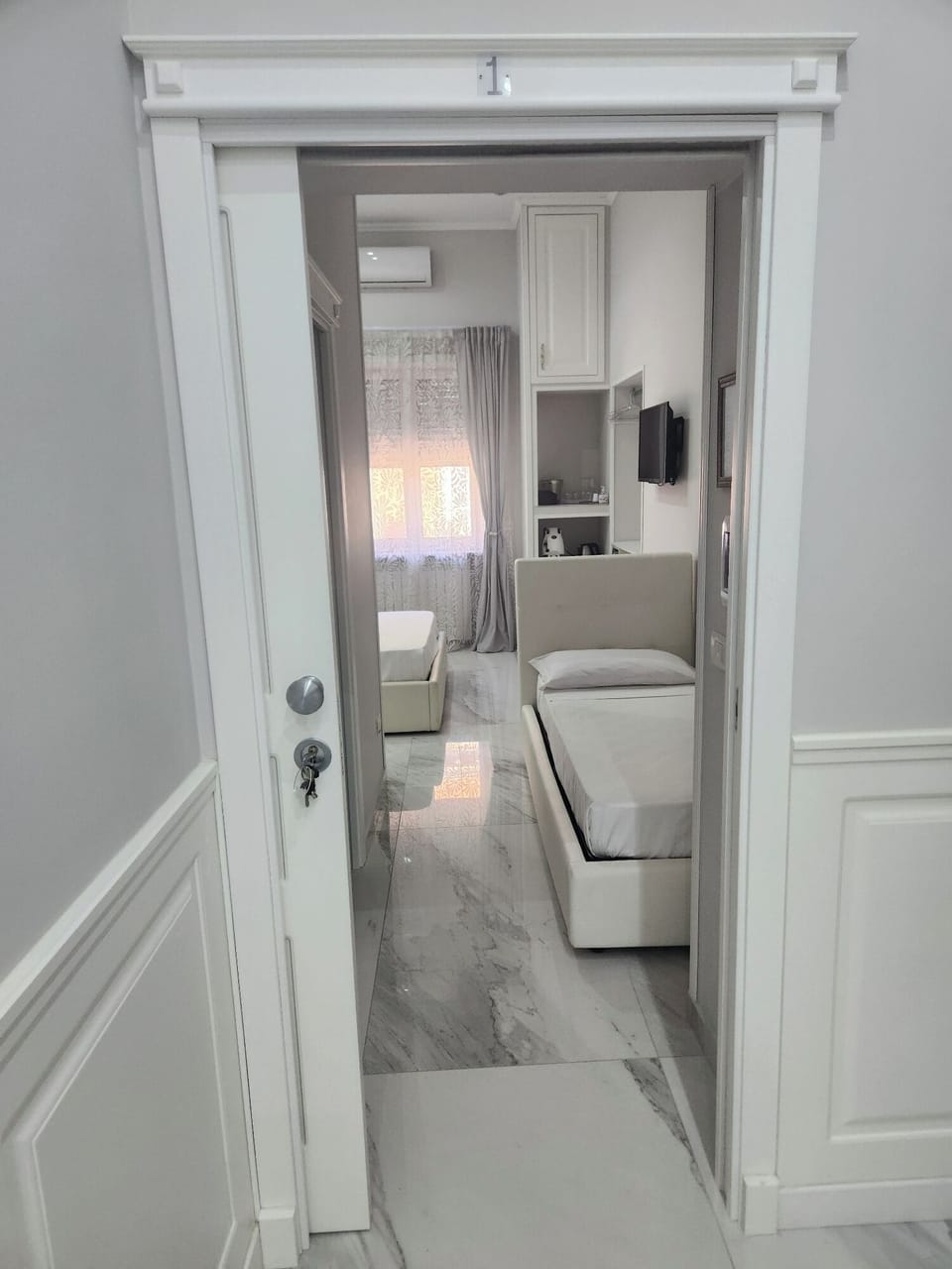 Standard Triple Room, Balcony, City View | In-room safe, desk, laptop workspace, blackout drapes