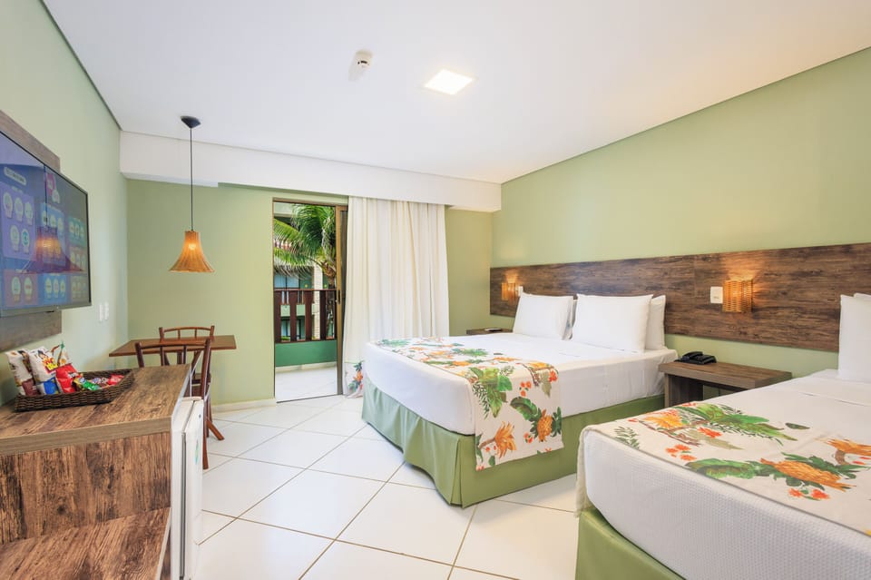 Standard Triple Room | Pillowtop beds, minibar, in-room safe, individually decorated