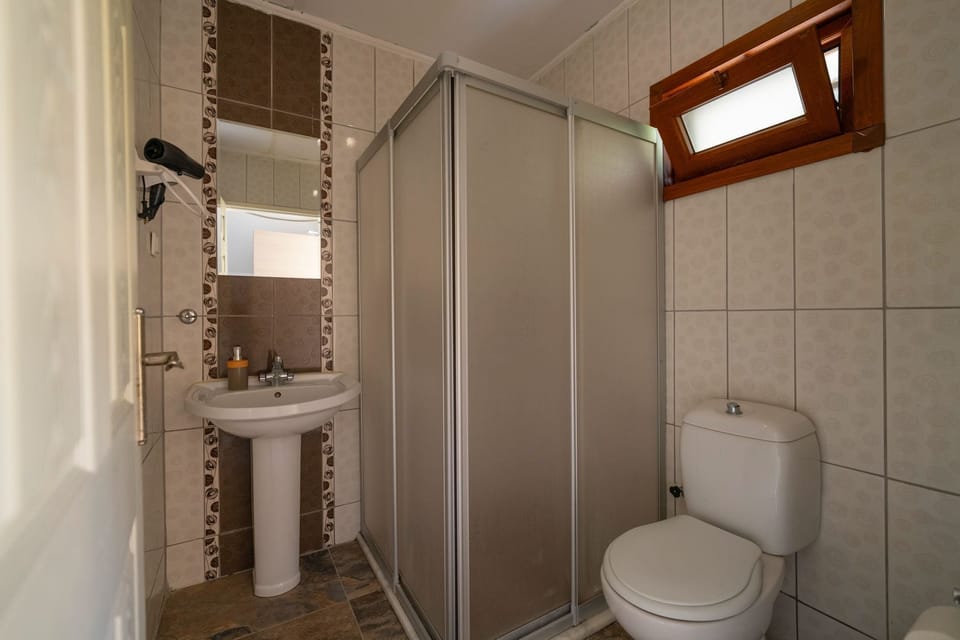 Honeymoon Room, 1 Queen Bed, Sea View | Bathroom | Shower, free toiletries, hair dryer, slippers