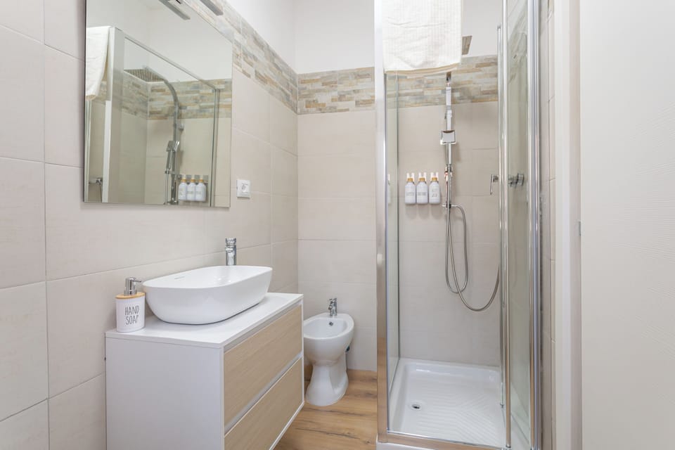 Deluxe Double Room, Balcony, City View | Bathroom | Shower, hair dryer, towels, soap