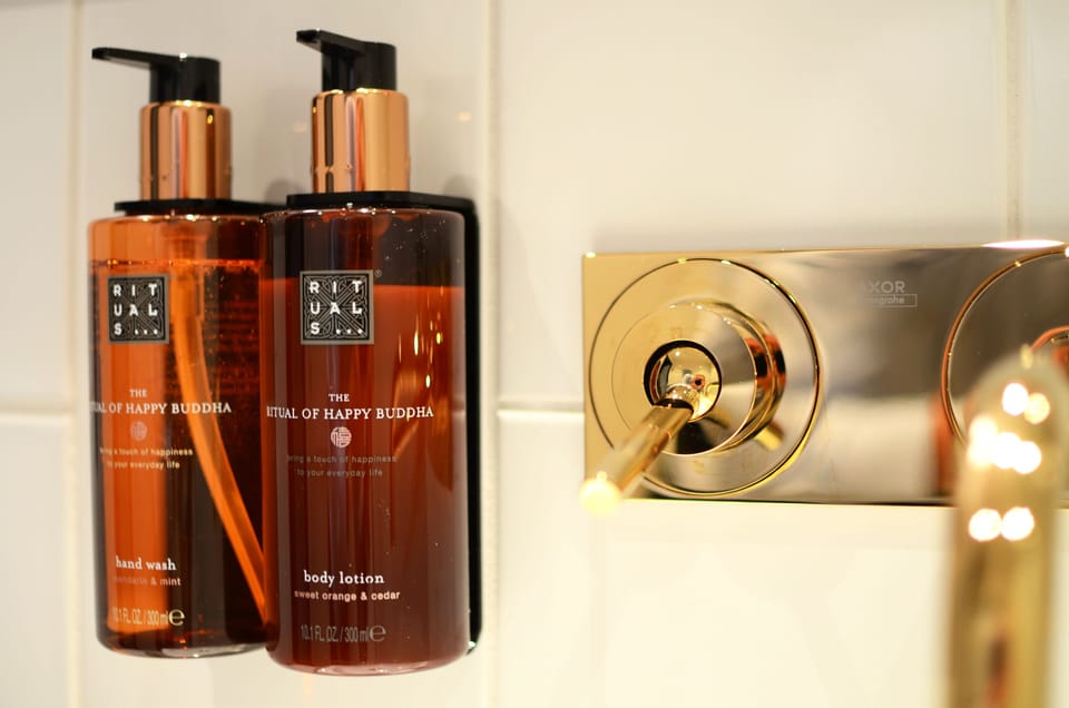 Shower, designer toiletries, hair dryer, towels