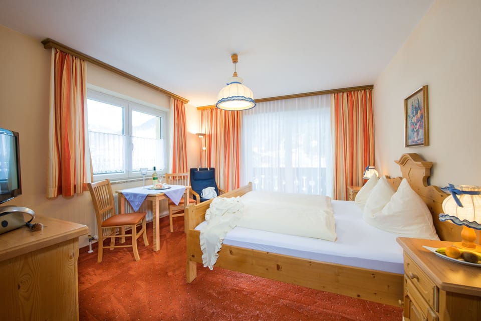 Double Room, Balcony, Mountain View | Minibar, in-room safe, desk, iron/ironing board