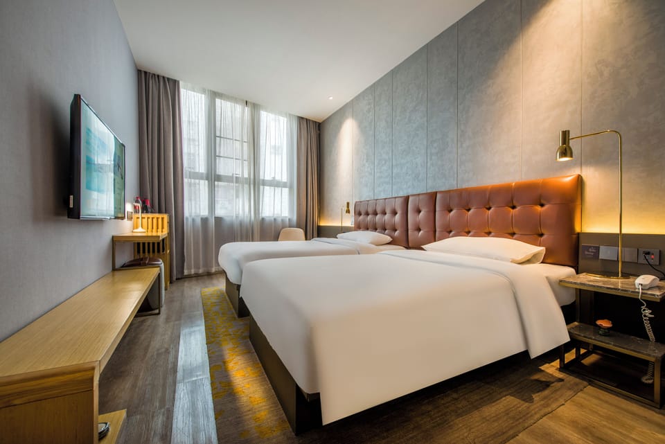 Basic Double Room, City View | Premium bedding, in-room safe, laptop workspace, blackout drapes