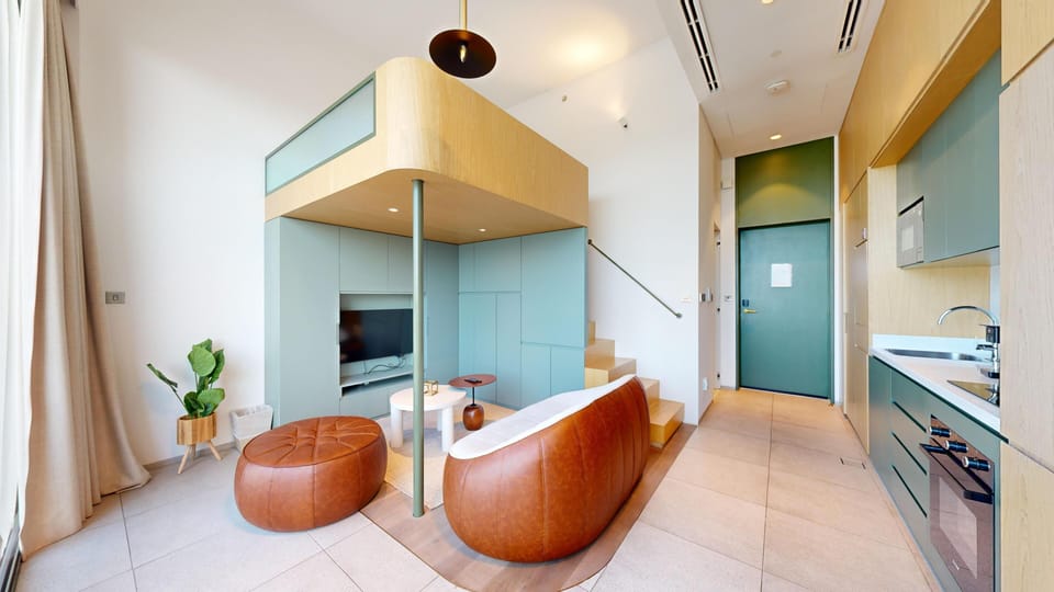 Deluxe Loft, 1 Queen Bed, Private Bathroom, City View | Desk, laptop workspace, blackout drapes, free WiFi