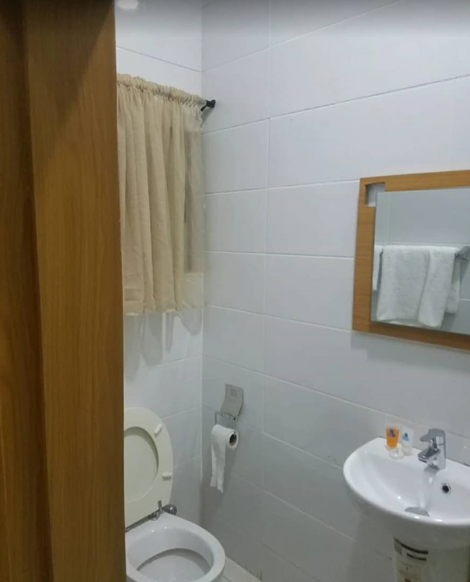 Separate tub and shower, towels, soap, toilet paper