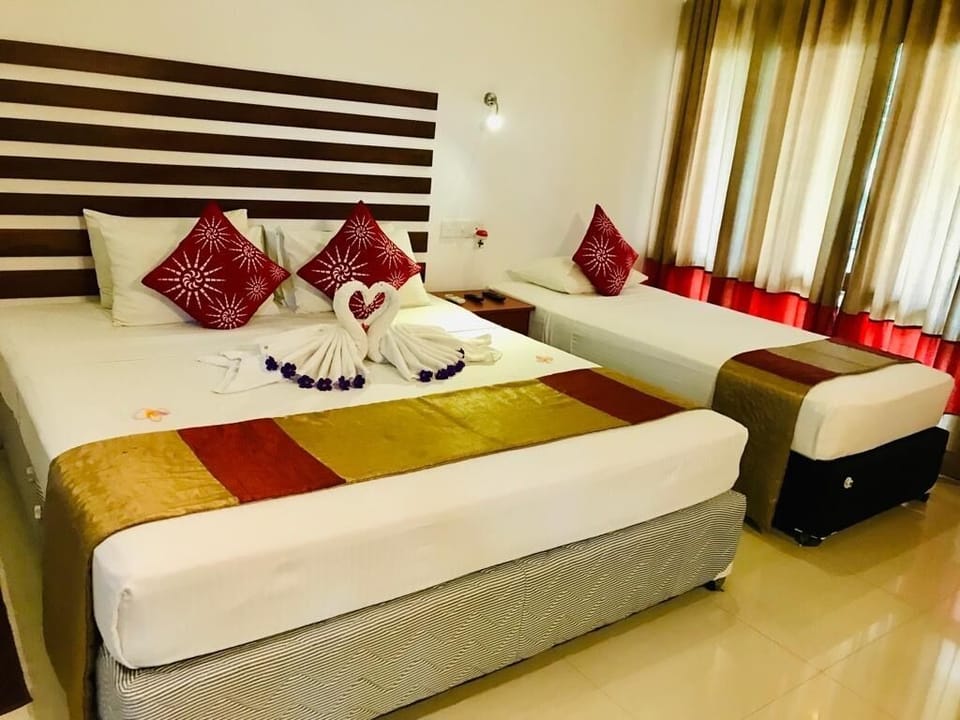 Deluxe Triple Room, Mountain View | Minibar, in-room safe, desk, cribs/infant beds