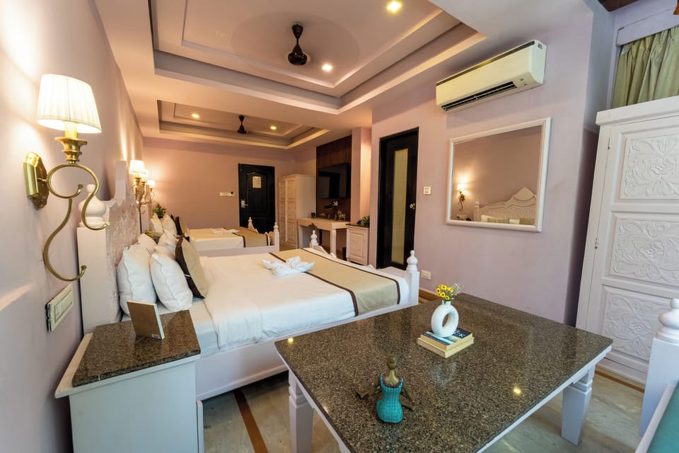 Family Room | Minibar, in-room safe, individually furnished, desk