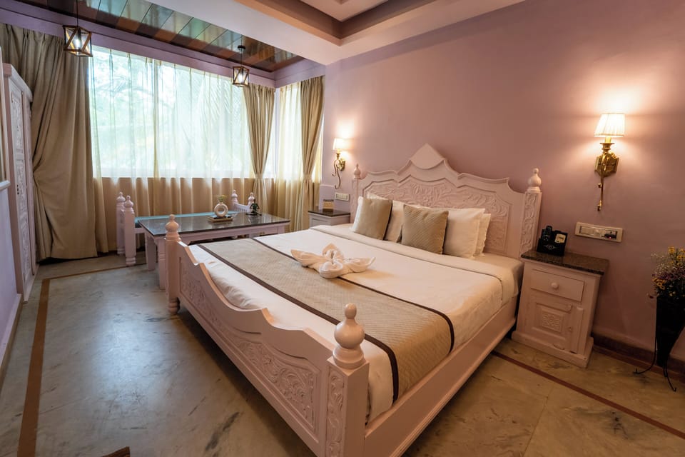 Family Room | Minibar, in-room safe, individually furnished, desk
