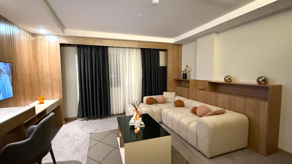 Junior Room | Living area | 55-inch Smart TV with satellite channels
