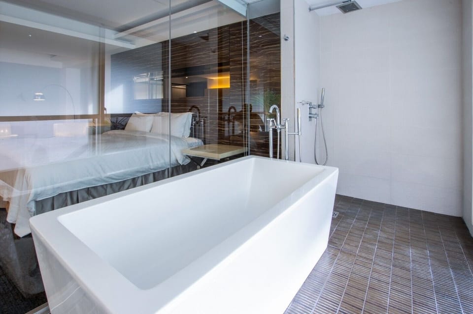 President Suit Room | Bathroom | Designer toiletries, hair dryer, slippers, towels