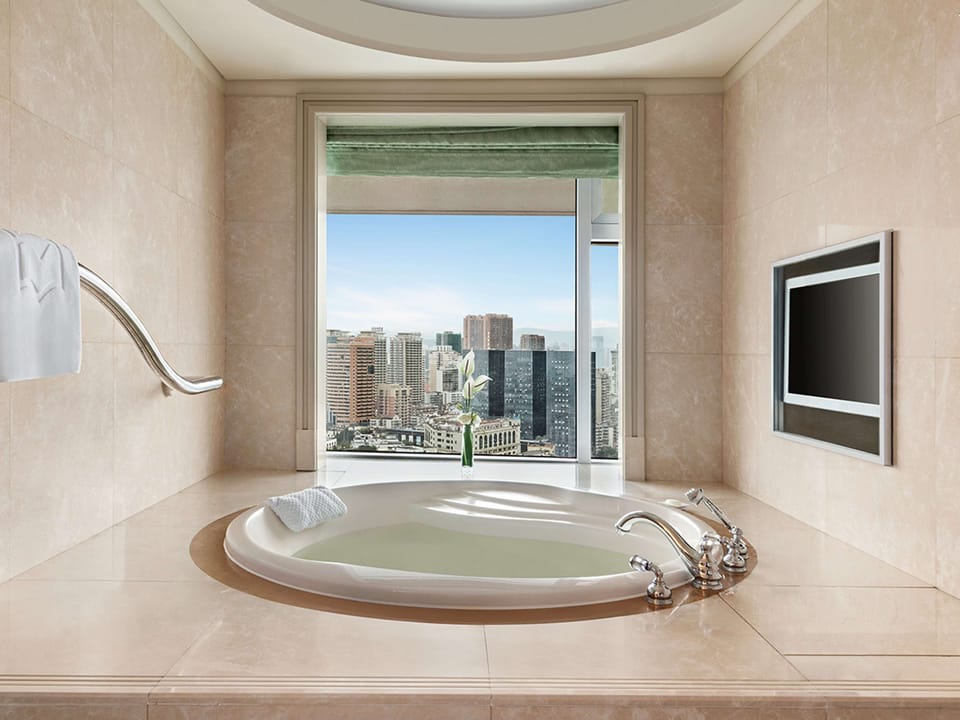 Separate tub and shower, rainfall showerhead, designer toiletries