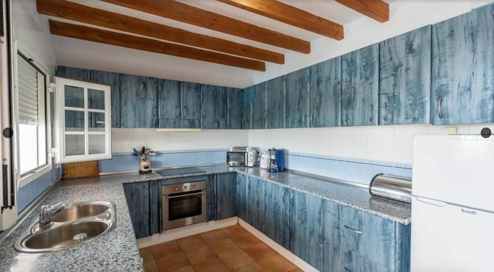 Villa | Private kitchen | Fridge, microwave, oven, stovetop