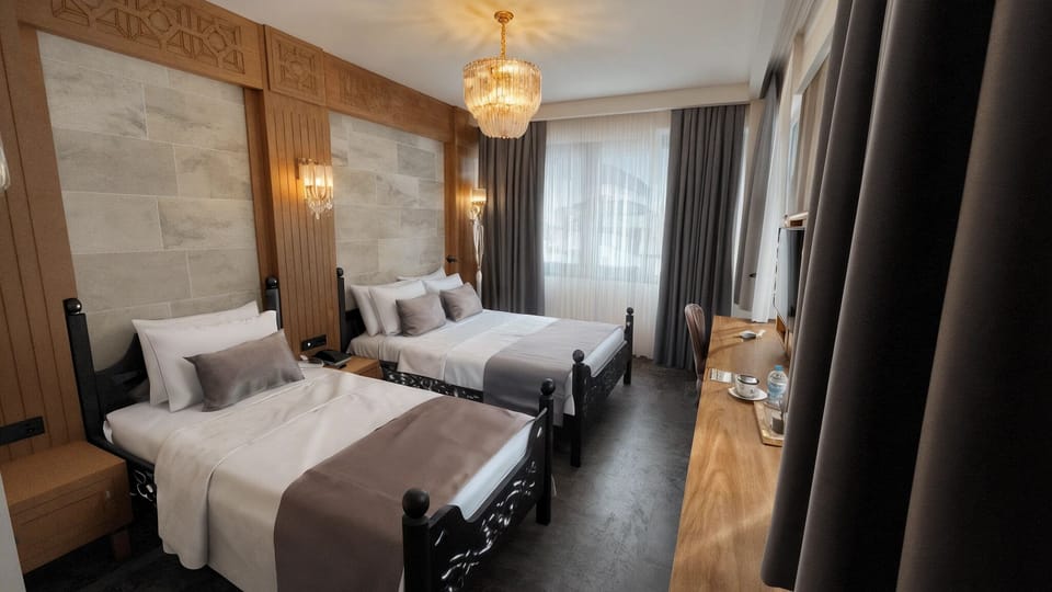 Family Twin Room, City View | In-room safe, desk, laptop workspace, soundproofing