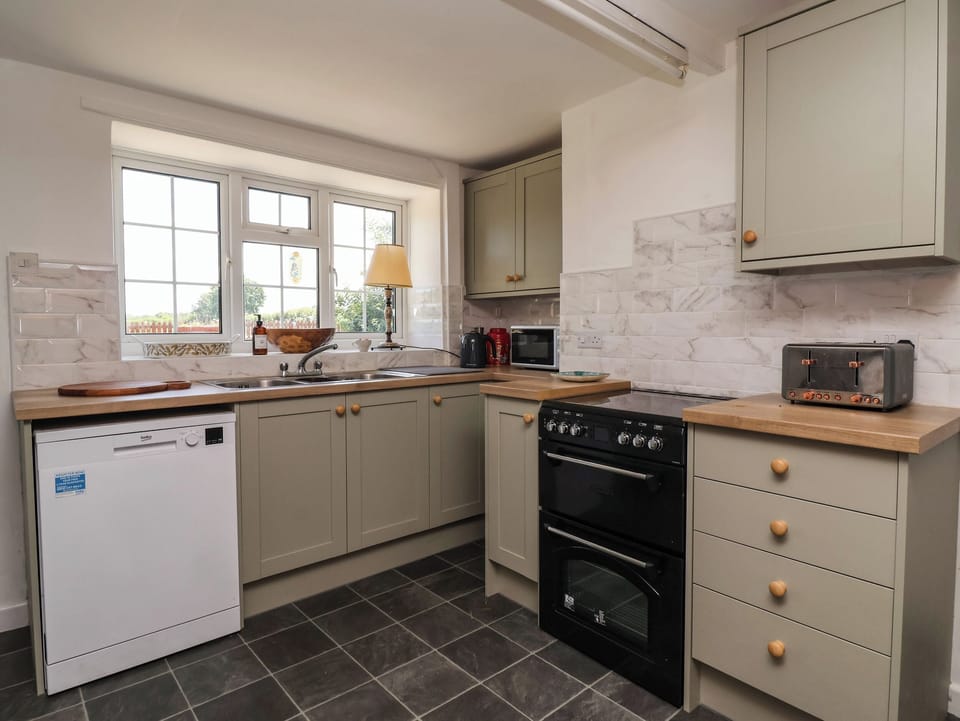Fridge, microwave, toaster, cookware/dishes/utensils