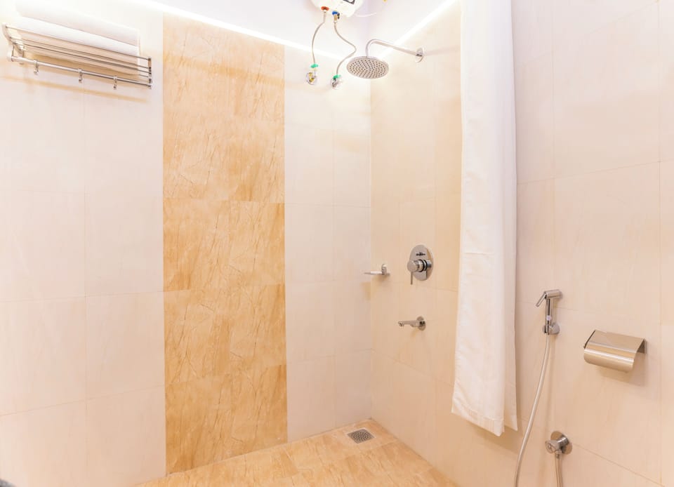 Luxury Room | Bathroom | Shower, towels, soap