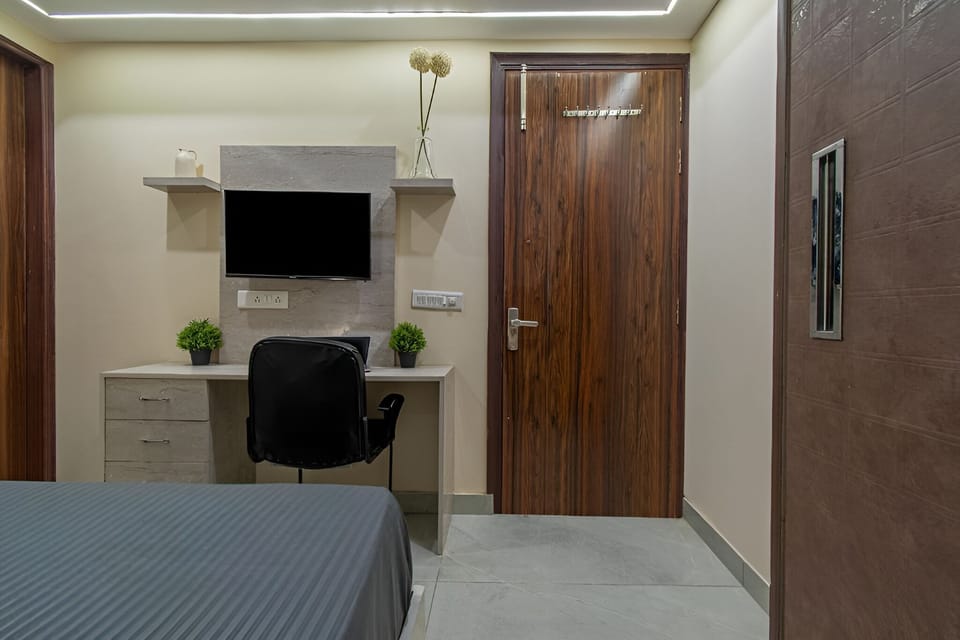 Desk, laptop workspace, blackout drapes, rollaway beds